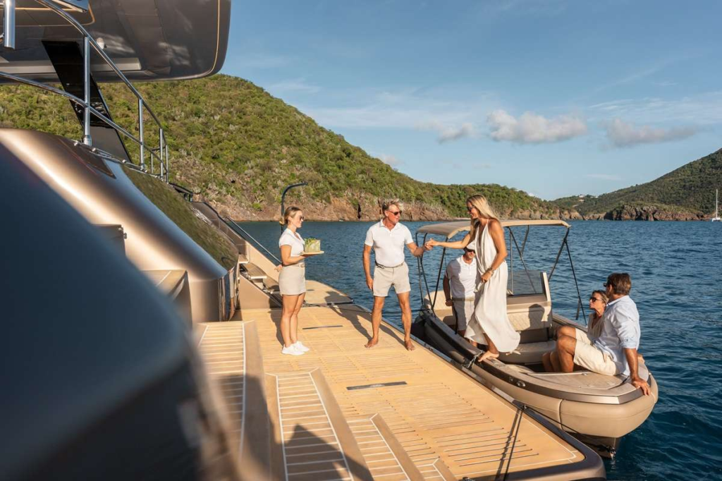Charter Yacht Sol Greeting Guests on Exterior Aft Platform Charter Yacht Sol Greeting Guests on Exterior Aft Platform