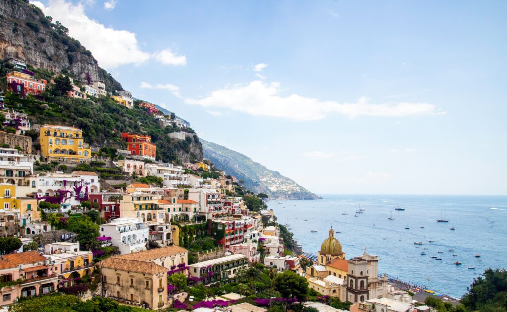 Colorful cliffside homes in Positano, Italy overlooking the Mediterranean Sea.