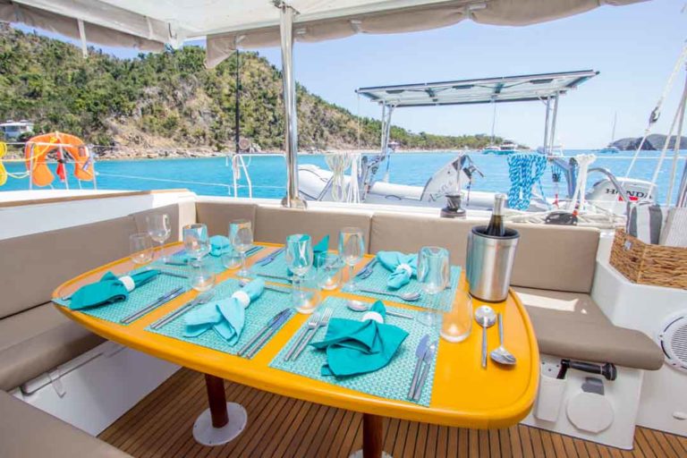 Azuria alfresco dining, fresh air vacations, caribbean charters, crewed yachts, turquoise water, regency yacht vacations