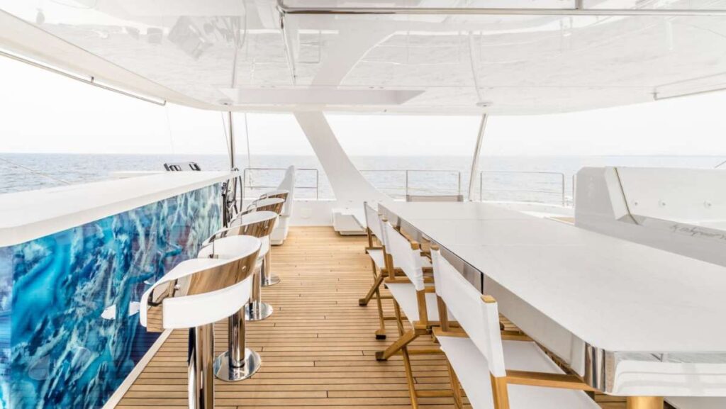 Shaded flybridge lounge on a crewed catamaran charter in the BVI